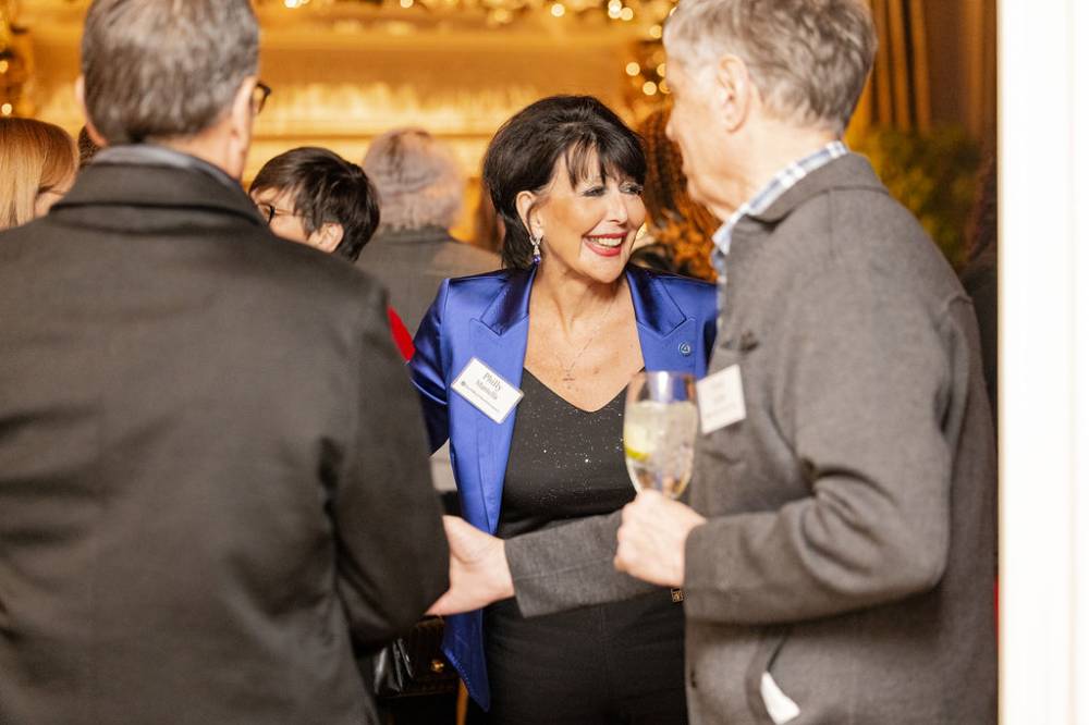 President Philomena Mantella greeting guests at receptoin